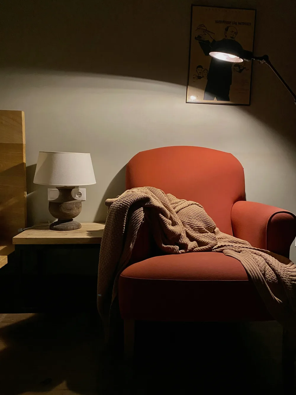 Cozy chair with a warm blanket and soft lamplight, a place to rest